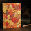 Thumbnail: A handmade A5 notebook with fabric cover featuring an autumn tree pattern