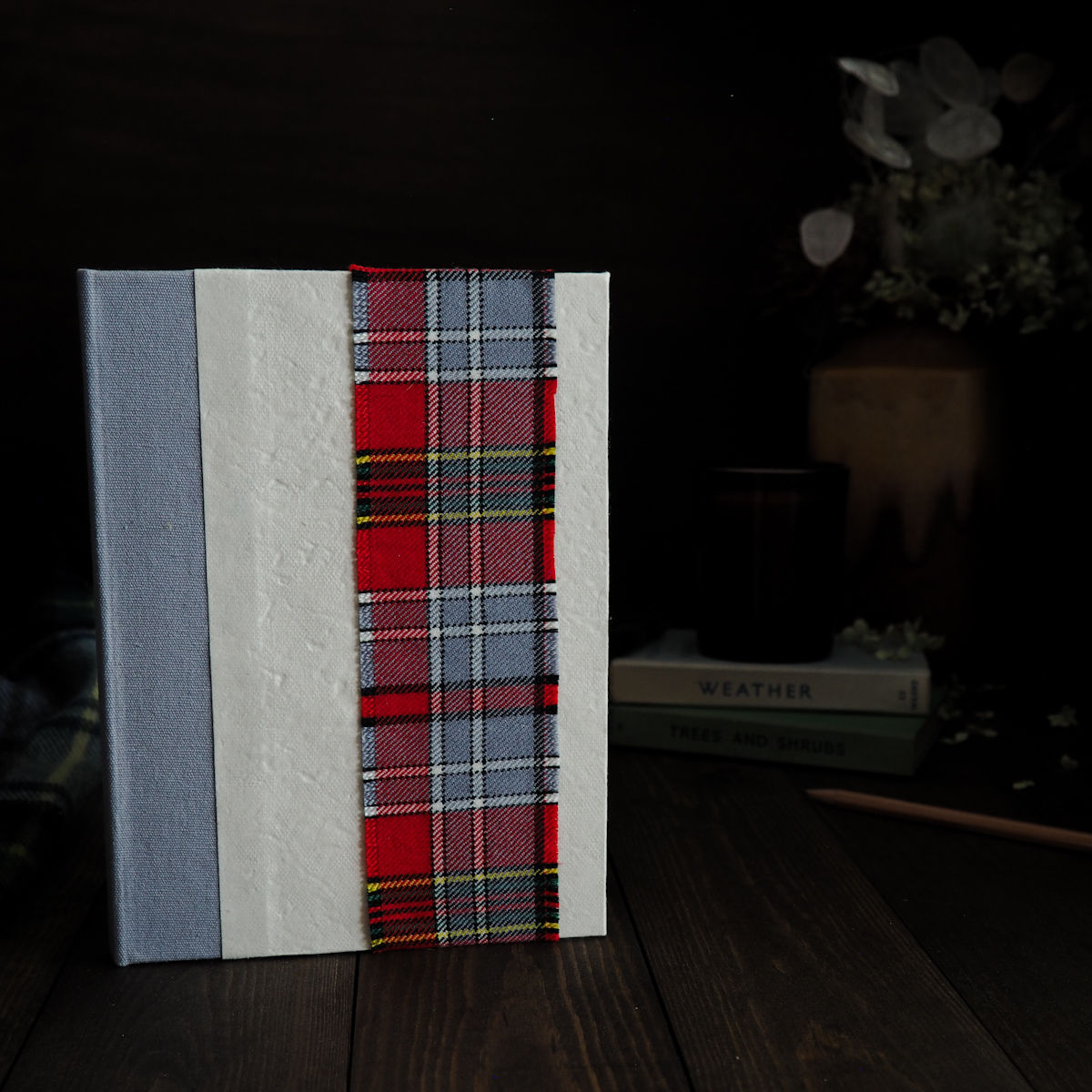 Handmade sketchbook with white cover, grey cloth spine and tartan band