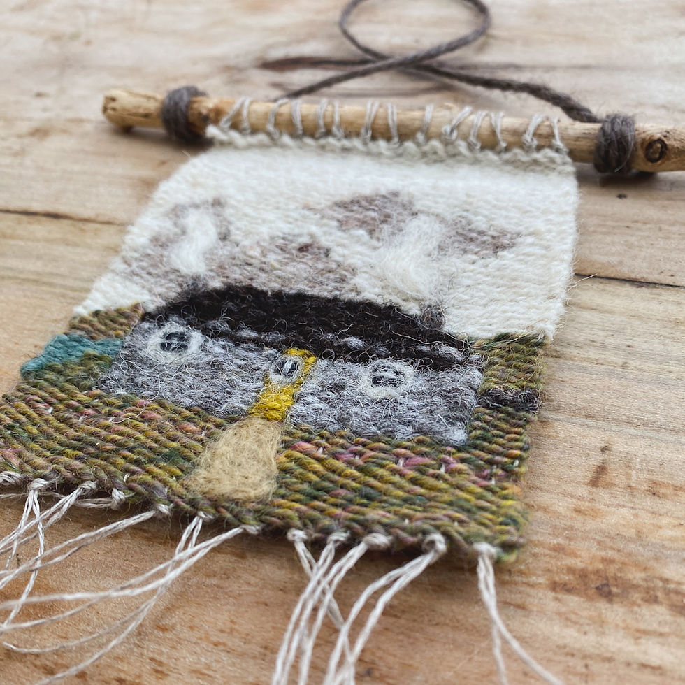 A close shot of a handwoven wall hanging with a blackhouse design