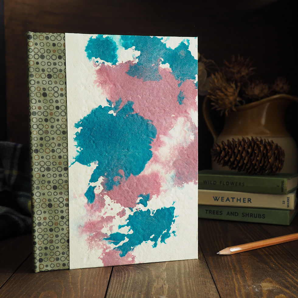 Beautiful unique ink swirl pattern cover on a handmade notebook