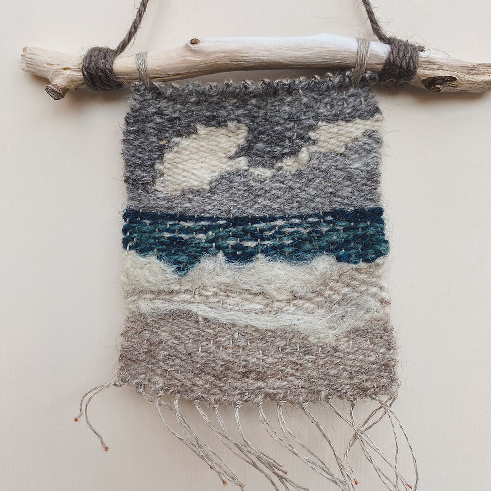 A wool wall hanging featuring a beach scene.