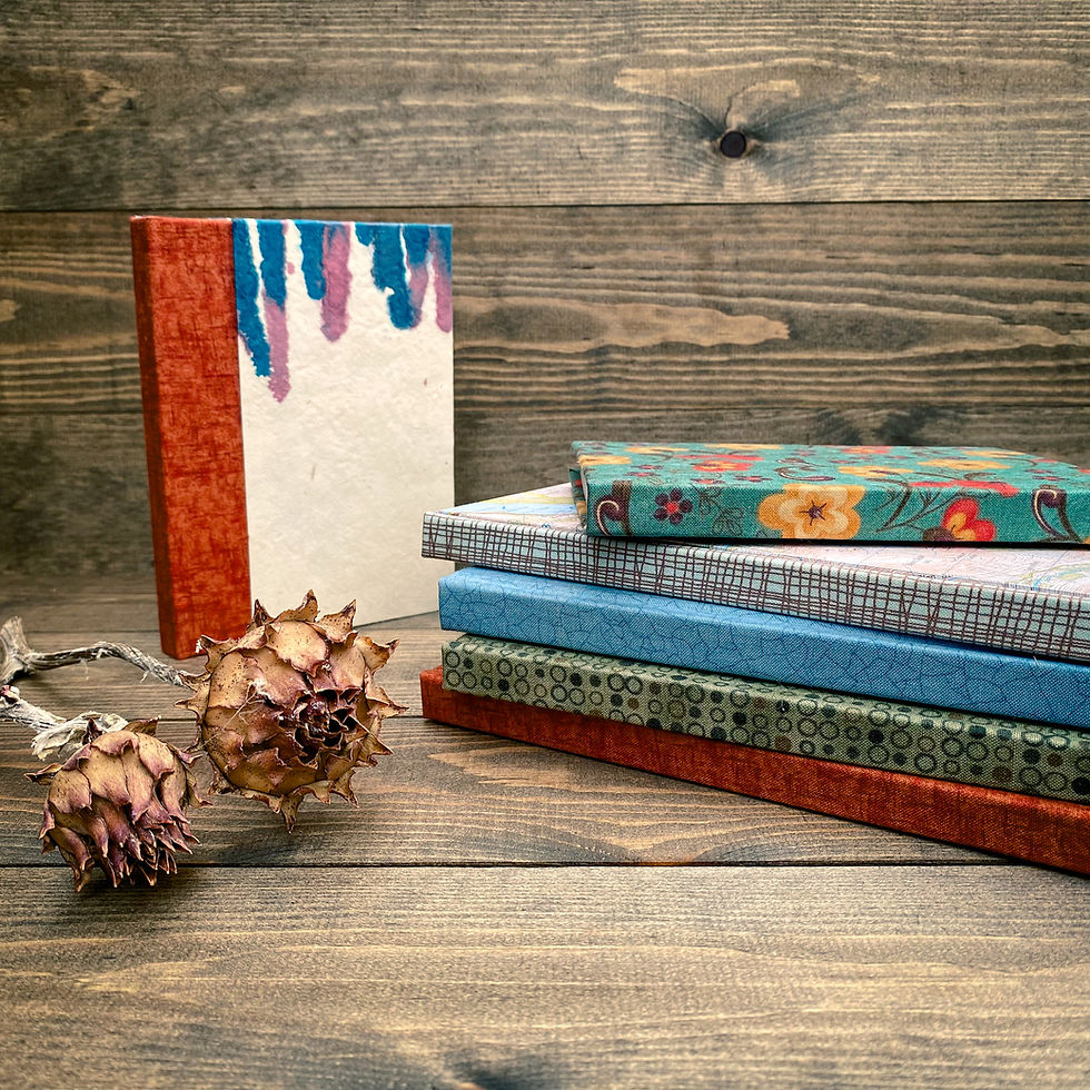 Thumbnail: A pile of handmade notebooks