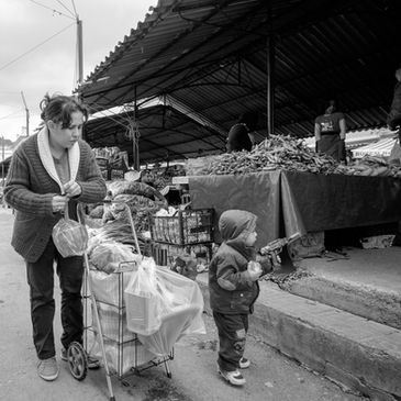 A mother and child shopping in a Turkish market in Mugla