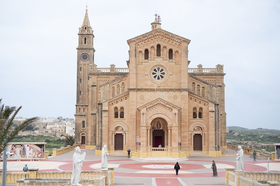 Ta' Pinu Basilica rising from Gozo’s countryside under dramatic skies
