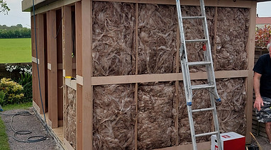 Wall of a garden room with insulation exposed
