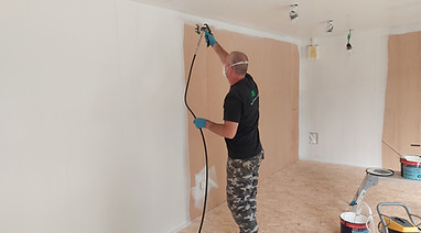 Man painting a wall