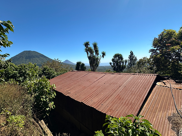 the house at the farm with a view of the volanic mountain ridge