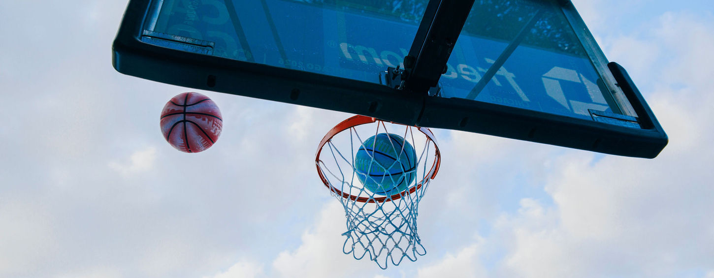 stage and court design for WNBA basketball activation with hero branding and messaging