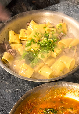 Pacheri cooking in a pan