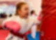 ninja tot throwing a punch with confidence in martial arts class