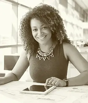 Young African American female architect working in an office_edited.webp