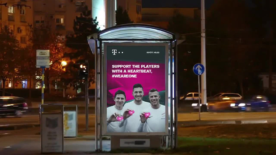 Three men on T-Mobile poster, "SUPPORT THE PLAYERS WITH A HEARTBEAT #WEAREONE".