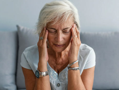 a woman with a migraine or chronic headace