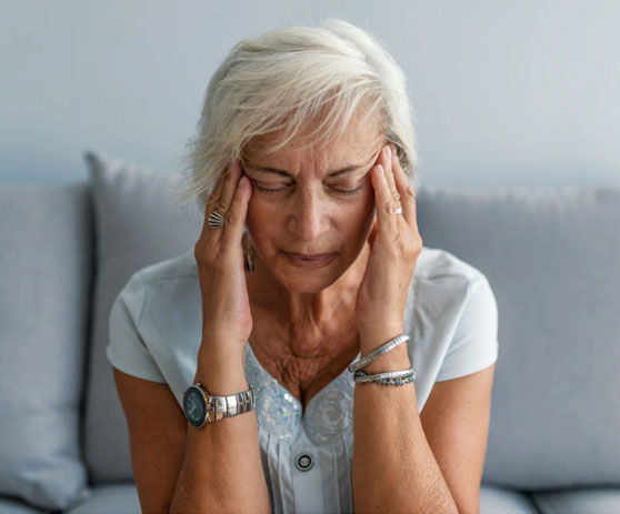 a woman with a migraine or chronic headace
