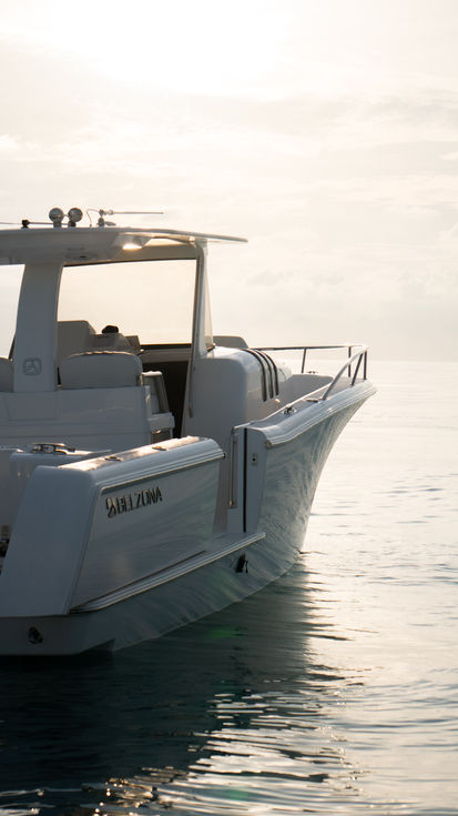 A Belzona Boat In The Sunrise With The Side Door Open