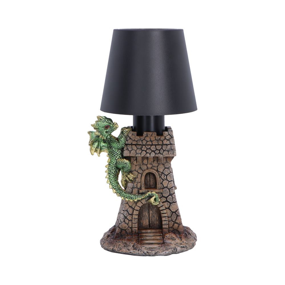 The Castle Keeper Lamp from Nemesis Now is an originally designed decorative lamp featuring a castle base with an adorable green dragon climbing its walls. Standing at 24.4cm tall, it is cast in high-quality resin and carefully hand-painted with classic dark stone colouring on the castle, while the shiny green dragon stands out beautifully. The lamp includes a touch-sensitive pad for easy activation, tap the top to switch it on and cycle through different lighting modes and conveniently USB rechargeable. Packaged securely to protect the detailed resin figure and lamp components, it arrives ready to display. Perfect for fantasy lovers, dragon enthusiasts, and collectors of whimsical decor, the Castle Keeper Lamp brings a magical touch and versatile lighting to any home.