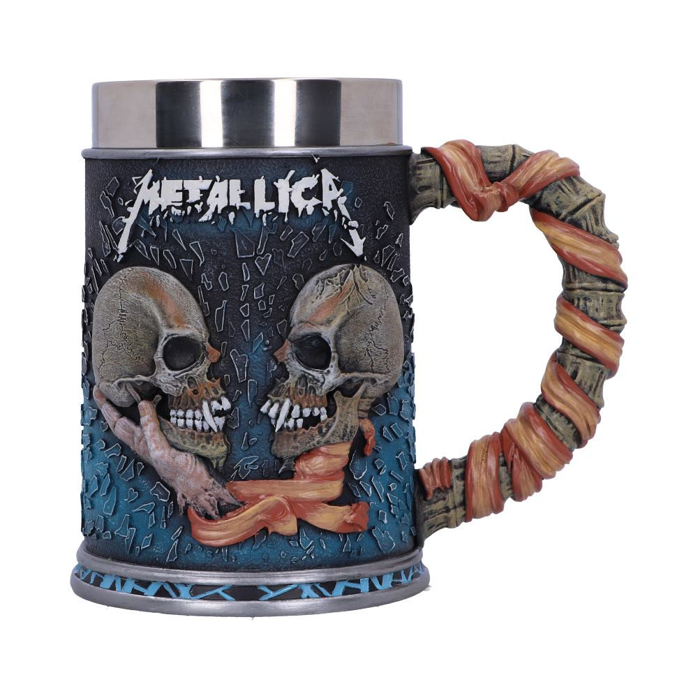 Have your favourite Metallica artwork on display at all times with this officially licensed Metallica Sad But True Tankard. The inspiration for the piece comes from the Sad but True artwork that was drawn up by their regular designer Pushead. A pair of fanged skulls face each other, one held up by a human hand, which seems to shred into pieces before becoming a stable base. The Metallica logo sits at the top of the Tankard torn, as shards of glass explode all around. Cast in the finest resin before being painstakingly hand-painted, this piece is the perfect way to pay homage to one the most influential heavy metal bands of all time!