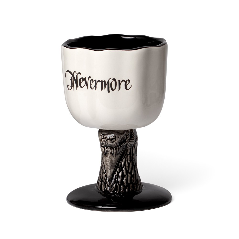 Embrace dark literary elegance with the Nevermore Raven Goblet Mug, inspired by the haunting poem The Raven by Edgar Allan Poe. Featuring a sculpted raven stem and etched "Nevermore" lettering, this striking goblet mug is a true statement piece for gothic decor lovers, literature fans, and collectors of alternative homeware. Finished in glossy black and white glaze, the detailed raven base creates a dramatic silhouette while offering a comfortable grip. Supplied in an official Alchemy branded gift box, it makes a perfect gothic gift for birthdays, Halloween, or special occasions. Designed and developed in England by Alchemy. this goblet blends literary inspiration with iconic gothic craftsmanship. Features • Sculpted raven stem design • Etched "Nevermore" lettering inspired by The Raven • Glazed black & white ceramic finish • Capacity: 340ml / 11.5oz • Material: Glazed earthenware ceramic • Supplied in Alchemy branded gift box • Designed in England, made in China • Care: Hand wash only, not microwave safe • Forms part of the iconic and extraordinary Alchemy home & gift collection