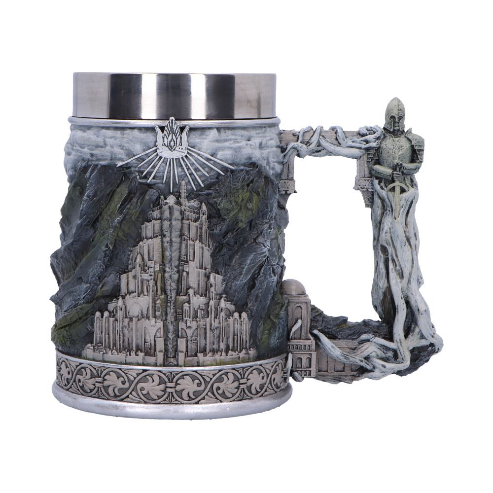 Embark on a journey through Middle-earth™ with this Officially Licensed Lord of the Rings Gondor™ Tankard – a regal and meticulously crafted vessel that pays homage to the storied realm of Gondor™. Crafted with precision and adorned with iconic symbols from the legendary saga by J.R.R. Tolkien, this tankard is a true testament to the spirit of the White City. Featuring intricate engravings that showcase the iconic symbols of Gondor – the White Tree of Gondor™, the symbol of the realm's royal lineage, and the stunning architecture of the city itself. Cast in the finest resin before being expertly hand-painted, whether you are a devoted fan of The Lord of the Rings, or a collector of exquisite fantasy-themed artifacts, the Gondor™ Tankard is a true treasure.