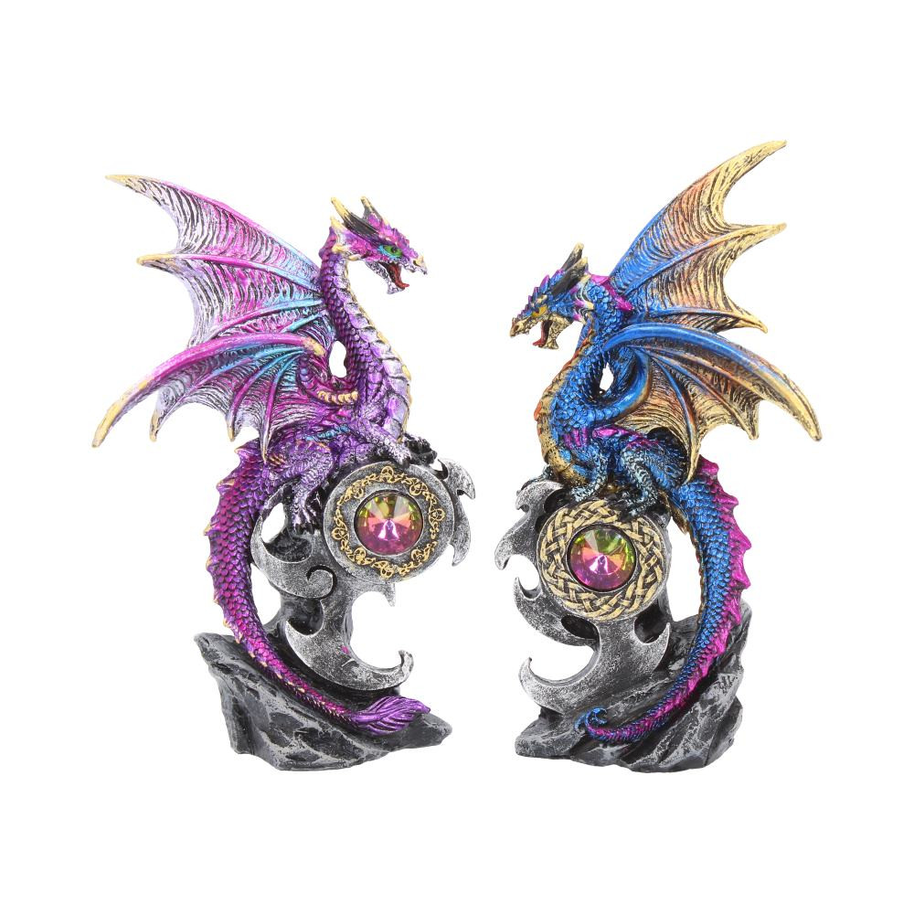Stood atop a framed jewel, these elegant blue and purple Dragons survey their realm. Clinging to their perch, their wings are spread wide, covered in small scales, coloured with purple, blue, silver and golden tones. Their tails curve around the base, resting at the bottom of their rocky home. Cast in the finest resin before being expertly hand-painted, these Dragons will be the perfect addition to any Fantasy collection. Keep them together or separate them as gifts (if you're feeling generous).