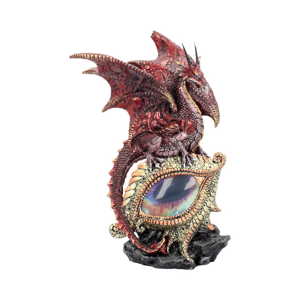 From Fantasy brand Nemesis Now's giftware collection, this fantastic Fantasy figurine is cast in high-quality resin before being expertly hand-painted. Resting on an outcrop of black rock, this large draconic left eye stares unblinkingly, blue clouds swirling to fill its gaze. Atop the brow, wings raised in a threat position, a red-scaled Dragon snarls menacingly, ready to face any challenger. Its tail curls down around the eye protectively.