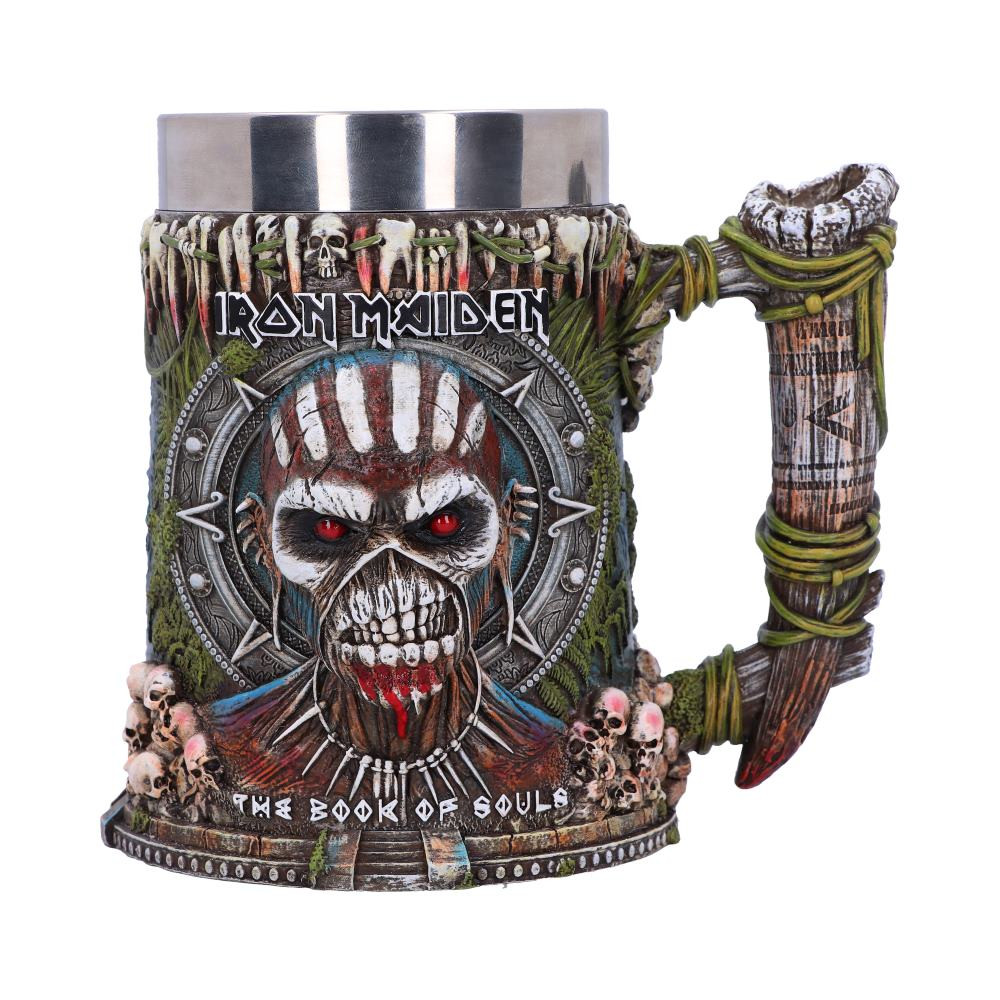 Show your allegiance to the Monsters of Rock with this electrifying and officially licensed Iron Maiden Book of Souls tankard. The zombie like music icon emerges from the front and back of the tankard, staring forward with is piercing red eyes and intimidating all those that pass by. Surrounded by tribal symbols and skulls inspired by the artwork featured within the bands Book of Souls album. Cast in high-quality resin and hand-painted, the tankard comes with a removeable stainless steel insert so you can spend less time cleaning and more time rocking!
