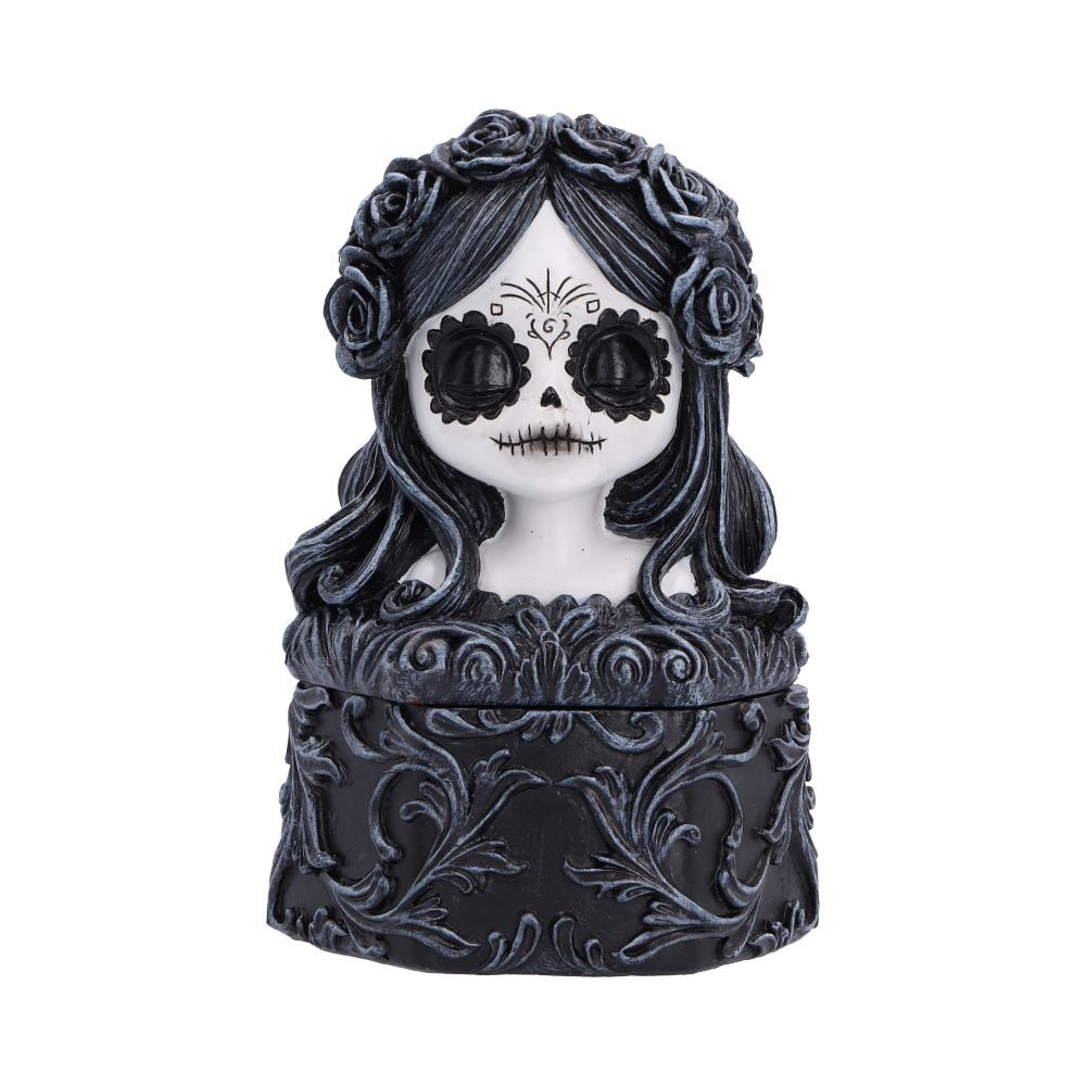 The Flor De Muerte Trinket Box is an originally designed keepsake box featuring the beautifully sculpted head of a Day of the Dead girl as its removable lid. Expertly hand-painted in striking black and white, she features flowing floral hair, black eyes and white skin, while the box is decorated with an intricate dark floral pattern, creating a stunning gothic display piece that’s perfect for storing jewellery, trinkets and treasured keepsakes. Packaged securely to help protect its detailed finish, it's an ideal gift for fans of gothic decor, alternative art and Day of the Dead-inspired designs. Add a touch of dark elegance to your home with this beautifully crafted trinket box that's practical as it is eye-catching.