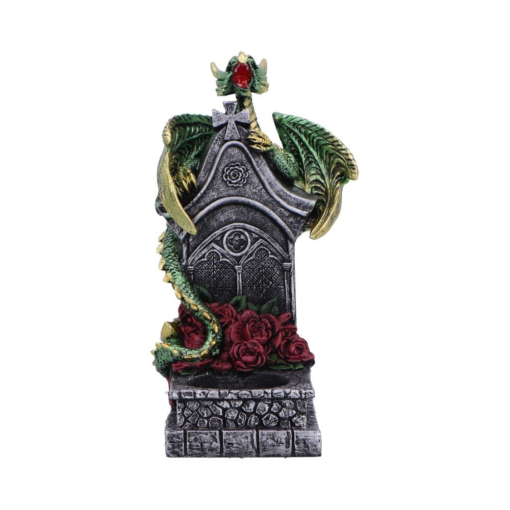 The Light of the Dragon Green is a beautifully crafted tea light holder featuring a green dragon with golden highlights on its wings and scales, coiled around a stone tombstone base. The grey stone finish, dry-brushed for added realism, creates a gothic, aged appearance. Roses at the base complete the design. This functional tea light holder brings both fantasy and light to any space, making it an eye-catching piece for any retailer's collection.