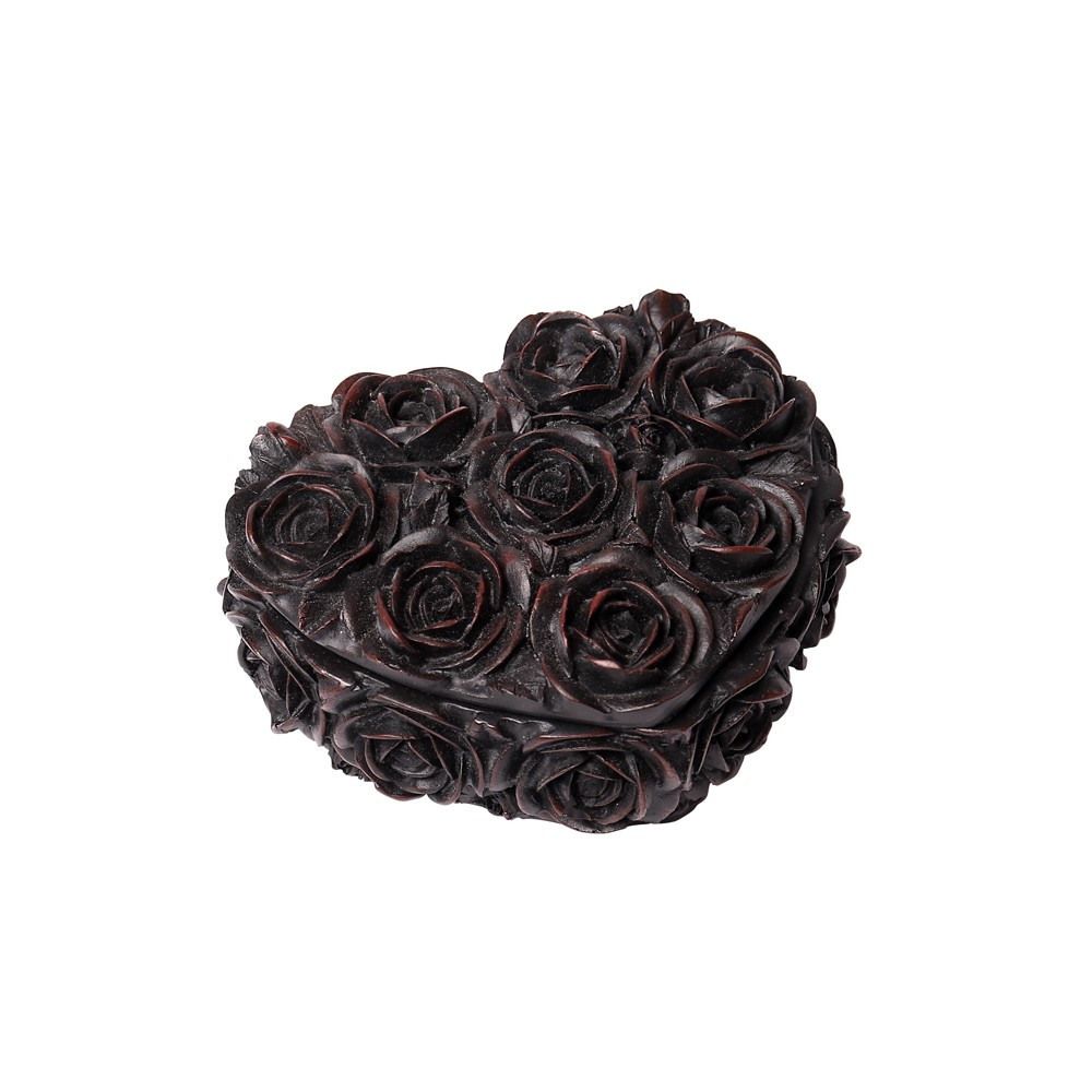 A delicate rose detailed, heart shaped trinket box. The perfect place for treasured keepsakes to hide.