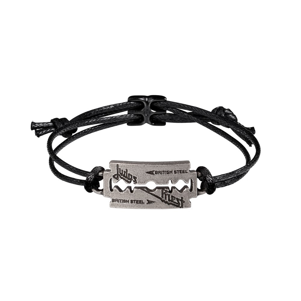 Show your devotion to heavy metal royalty with this striking Judas Priest Razorblade bracelet, featuring the legendary British Steel razorblade logo in antiqued pewter. This handcrafted piece pairs the iconic design with an adjustable black cord wrist strap and a blackened pewter fastener for a bold, battle-ready finish. Expertly made in England, the razorblade charm boasts a rugged, vintage look that captures the raw power of Judas Priest's sound. The sturdy cord and pewter components ensure lasting wear, whether you're in the pit, on the road, or just living loud. • Inspired by Judas Priest's iconic British Steel razorblade logo • Antiqued pewter emblem for an authentic, vintage-metal look • Blackened pewter fastener - tough, secure, and stylish • Adjustable black cord strap for a comfortable, universal fit • Handmade in England with rock-solid craftsmanship • Perfect for fans of classic metal, rock fashion, and band memorabilia • Official licensed merchandise Unleash your inner metalhead with this Judas Priest razorblade bracelet. A handcrafted tribute to one of heavy metal's most powerful forces.