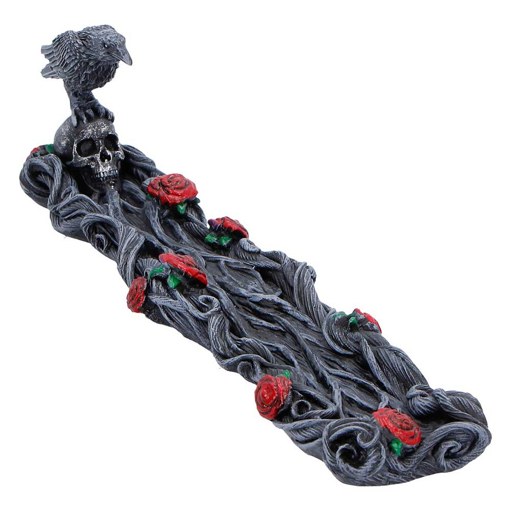 The Twilight Bloom Incense Burner from Nemesis Now is a beautifully crafted gothic decor piece, perfect for adding atmosphere and elegance to any space. It features a twisted branch-like detailing, red roses along the holder, and a raven perched atop a skull, all cast in high-quality resin and hand-painted for intricate detail. Each burner is carefully packaged in a branded box, making it ideal for gifting or display. Perfect for gothic art enthusiasts, fantasy decor lovers, and fans of alternative home accessories, this incense burner brings a touch of dark romance and mysterious charm to your home.