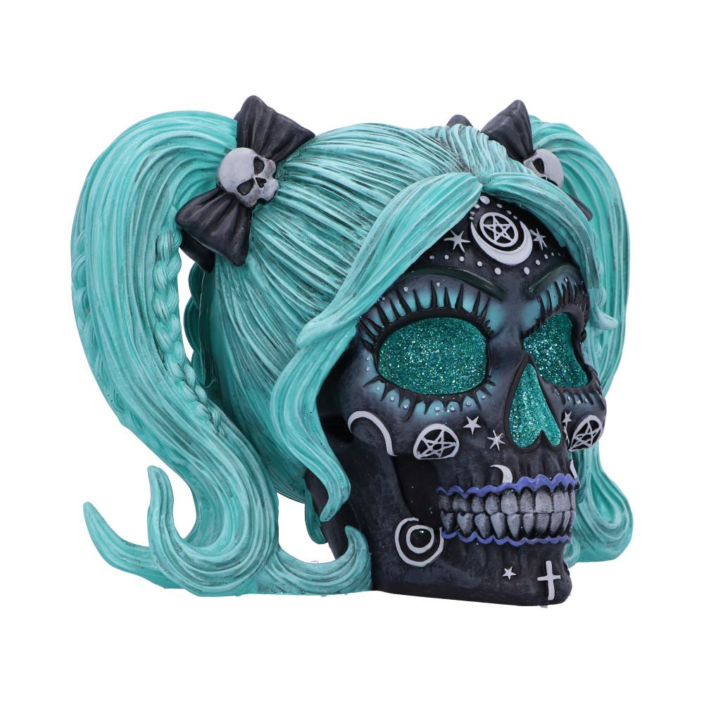 Introducing our captivating Drop Dead Gorgeous - Cute and Cosmic skull, a unique and enchanting fusion of mysticism, charm and darkness. Adorned with vibrant turquoise features and witchy patterns. Creating an atmosphere of curiosity and a connection to the unseen, this piece serves as a unique and eye-catching skull in any space. Cast in the finest resin before being expertly hand-painted, this Drop Dead Gorgeous - Cute and Cosmic skull will ignite your imagination and make the ideal statement where ever you choose to display it.