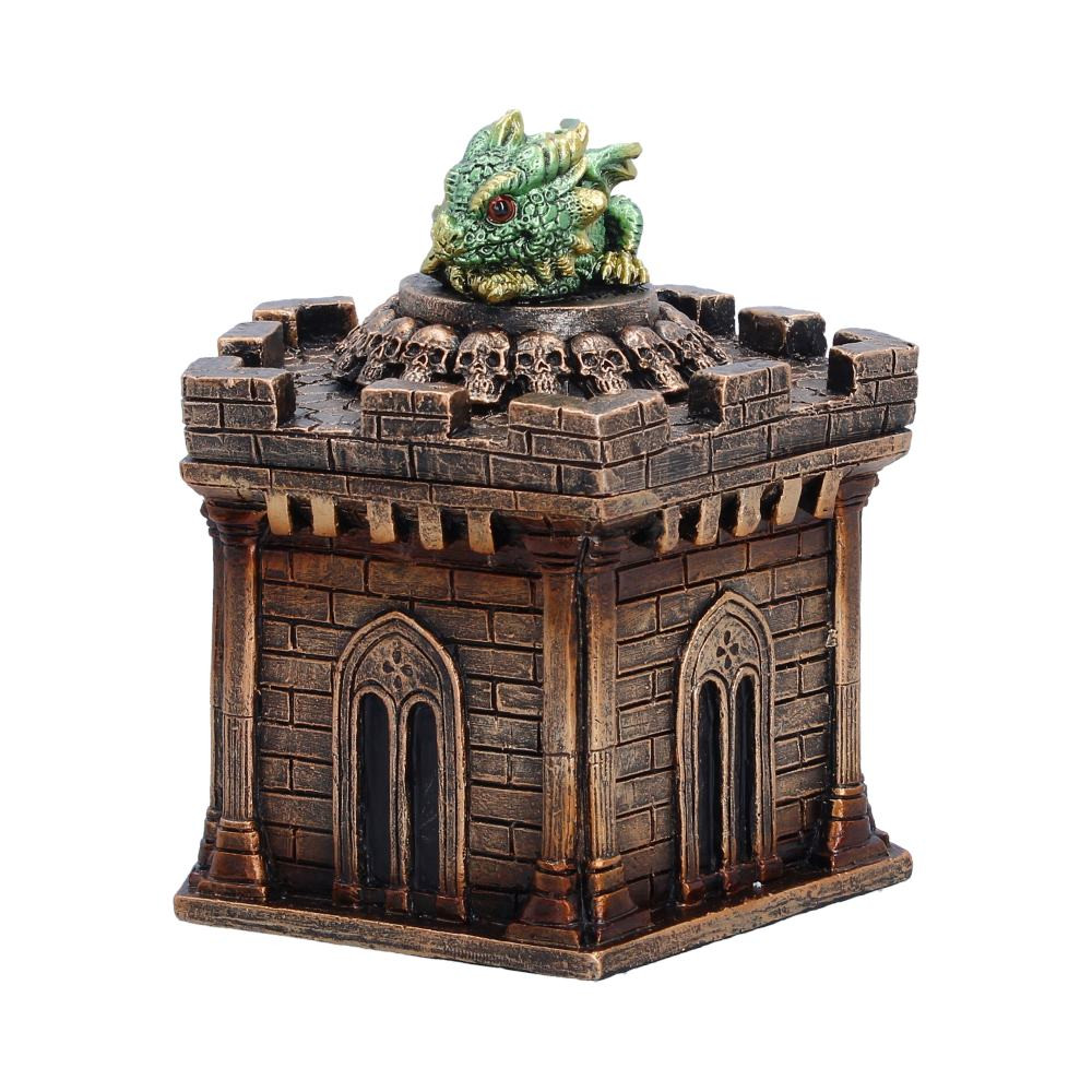 The Warden of the Crypt Box is an originally designed dragon trinket box from Nemesis Now, featuring a cute green dragon curled protectively atop a crypt-inspired box. Standing 12.5cm tall, the piece is richly detailed, with dark colouring, skull accents, and textured stone-like patterns that create a miniature castle crypt. The removable lid reveals a small compartment perfect for storing small keepsakes, while the hand-painted dark brown and metallic-like tones beautifully contrast with the vivid green dragon. Securely packaged for protection, this decorative box is ideal for fantasy collectors, dragon enthusiasts, and gothic decor lovers who want a charming yet mystical guardian for their treasured items.