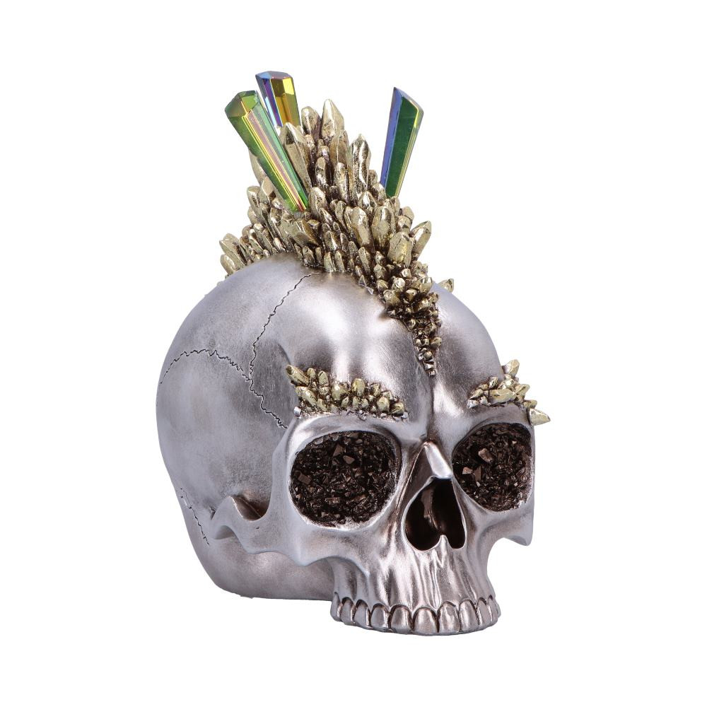 The Chromatic Crystal Skull from Nemesis Now is a bold and captivating decor piece that fuses a gothic edge with a touch of crystal mystique. Crafted from high-quality resin with a sleek chrome-like finish, it features crystal shards forming a dramatic mohawk, with additional crystal textures in the eye sockets and eyebrows. Packaged in a branded Nemesis Now box, it arrives ready to give or display. Perfect for fans of alternative decor, fantasy collectors, and those who love standout home accents, this skull adds fierce personality and shimmering detail to any space.