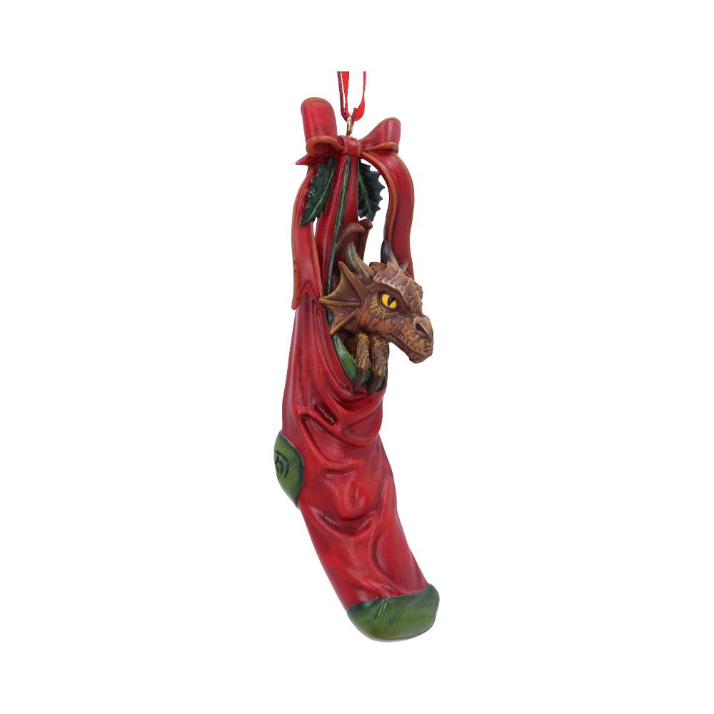 From world-renowned gothic and fantasy artist Anne Stokes, comes this Magical Arrival Hanging Ornament. Sitting snug inside a red stocking, this sneaky dragon peers over the edge wondering where all his presents have vanished to. Cast in the finest resin before being experty hand-painted this hanging ornament will sure be a festive favourite.