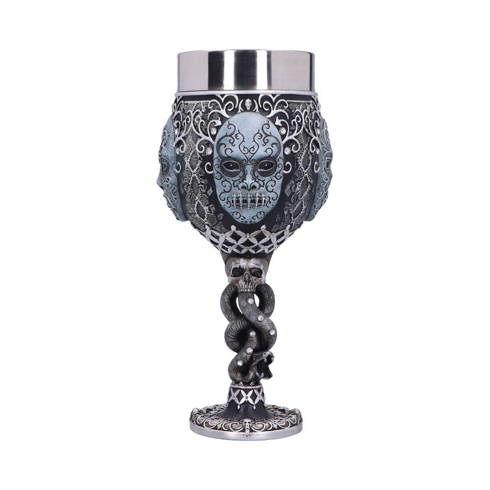 Show your allegiance to He Who Must Not Be Named with this officially licensed Death Eater collectable Goblet from Nemesis Now. The Death Eaters were the name given to the most ardent followers of Lord Voldemort. They often wore black hoods and masks with snake-like eye slits to cover their faces, as shown by the ones on the sides of this beautifully sculpted goblet. The Dark Mark was usually burned into their left forearms, an effigy which can be seen forming the serpentine stem, adorned with Emerald jewels. Cast in the finest resin before being expertly hand-painted, this collectable Goblet is the perfect addition to any wizarding collection and can be enjoyed by witches, wizards and Muggles alike.