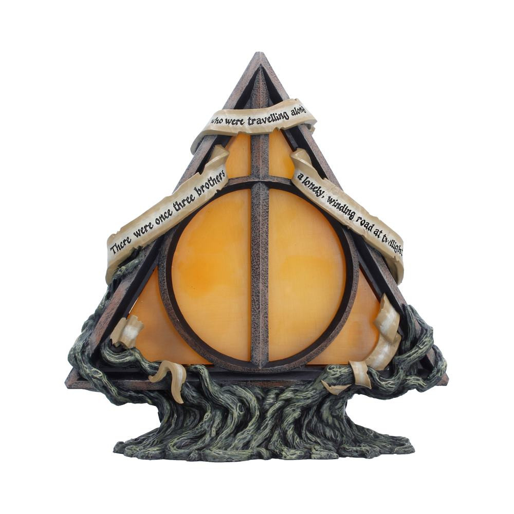 The Harry Potter Deathly Hallows Lamp is an officially licensed collectible inspired by the iconic final chapter of the Harry Potter franchise. It features the triangular Deathly Hallows emblem set atop a wrapped tree-like branch base, with intricate story inscriptions woven throughout the design. Standing 22cm tall, it is cast in high-quality resin and expertly hand-painted, and is powered via the included USB-C cable with a discreet side activation. It is ideal for Harry Potter fans, fantasy collectors, and lovers of detailed themed decor. Add a magical glow to your space with this beautifully crafted statement lamp celebrating one of the wizarding world’s most recognisable symbols.