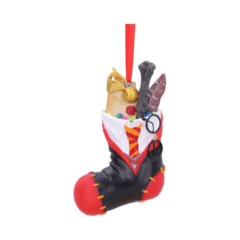 The Harry Potter Harry Stocking Hanging Ornament from Nemesis Now is an officially licensed decorative piece inspired by the Wizarding World. Cast in high-quality resin and expertly hand-painted, it features a classic sock-style stocking design incorporating Harry’s robes and Gryffindor tie, with iconic items such as his wand, the Golden Snitch, glasses and Hogwarts acceptance letter peeking from the top, finished with a red ribbon for hanging, Supplied in protective branded packaging, this ornament is ideal for Harry Potter fans, collectors and festive decor lovers, making it a magical addition to Christmas trees and seasonal displays.