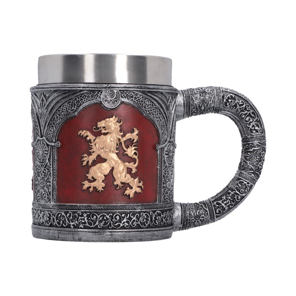 The Heraldic Lion Tankard is an originally designed medieval-inspired decorative piece featuring a bold red and gold Heraldic Lion crest on all four sides of the body. Expertly cast in high-quality resin and hand-painted with intricate detail, it is finished with dark silver medieval-style accents and ornate patterning throughout. Packaged in an originally designed medieval-themed Nemesis Now gift box, it is ideal for medieval enthusiasts, fantasy collectors, gothic decor fans, and lovers of heraldic design. Bring a powerful touch of medieval character to your collection with this striking tankard that stands out as a bold display piece in any home.