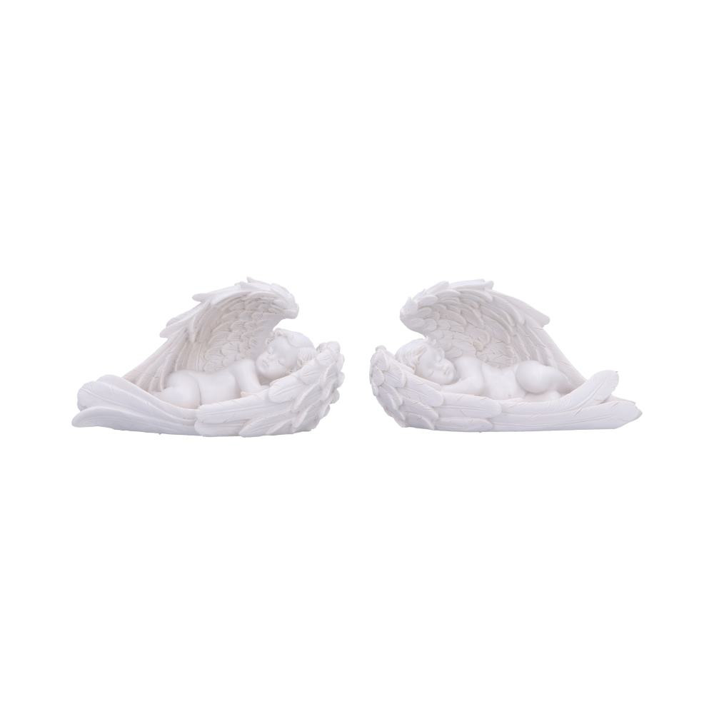Softly They Sleep is a delicate set of two cherubs peacefully resting within gently curved angel wings. Cast in resin and hand-painted in a soft white finish, each 10cm tall figure features intricate wing detailing that adds a touch of elegance and serenity. Carefully packaged to ensure safe delivery, this set makes a thoughtful gift or calming addition to any space. Perfect for angel collectors, memorial displays, or anyone seeking gentle, spiritual décor—these cherubs offer a heartfelt symbol of peace and protection for your home.