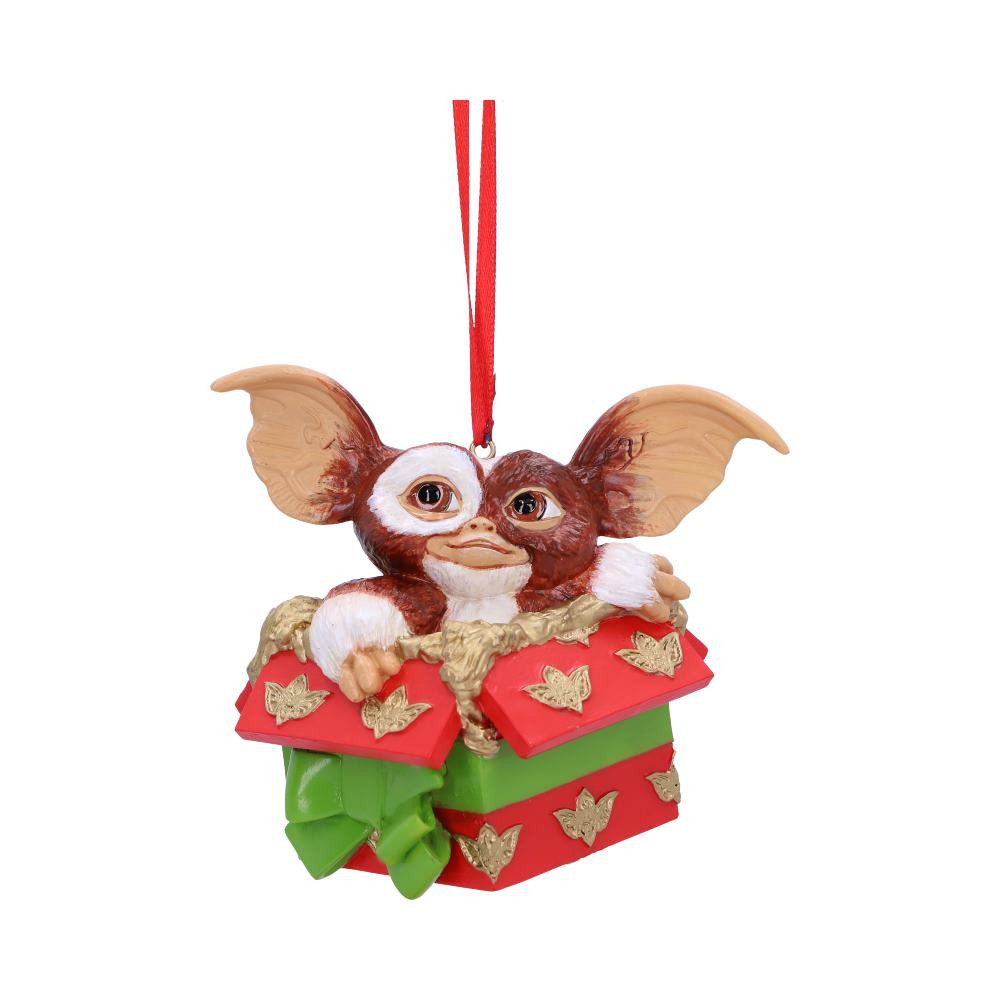 Gizmo and the Gremlins have taken us by storm! Emerging from a present, decorated in Gremlins wrapping paper, Gizmo can be seen looking up in a playful manner. Cast in the finest resin, before being expertly hand-painted this Gizmo Gift Hanging Ornament makes for the perfect addition to any Christmas collection.