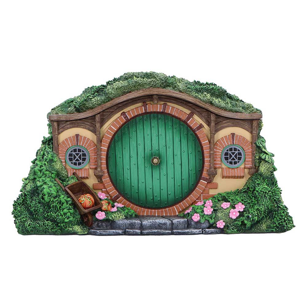 The Lord of the Rings The Shire Box is an officially licensed trinket box designed to resemble the charming Hobbit homes of the Shire. Crafted from high-quality resin and hand-painted with vibrant colours, it captures the lush green hills and cosy details of Hobbiton. The removable lid reveals a beautifully detailed interior, perfect for storing small keepsakes. Packaged in a themed collectors box, it makes an ideal gift for Tolkien fans, fantasy lovers, and collectors alike. Add a touch of Middle-earth magic to your space with this enchanting and functional collectible.