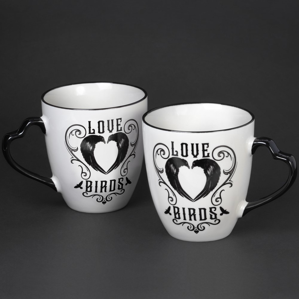These beautiful 'Love Birds' couple mugs feature original Alchemy art work of ravens forming a heart shape, the ultimate symbol of love just with a darker twist! These elegant mugs with unique heart shaped handles will be the perfect token of love for your one and only! Couple mug sets a truly unique and exquisite gift perfect for weddings, anniversary's or to show that special someone just how much you love them! This mug set is designed by Alchemy and forms part of the new and unique home and gift collection.
