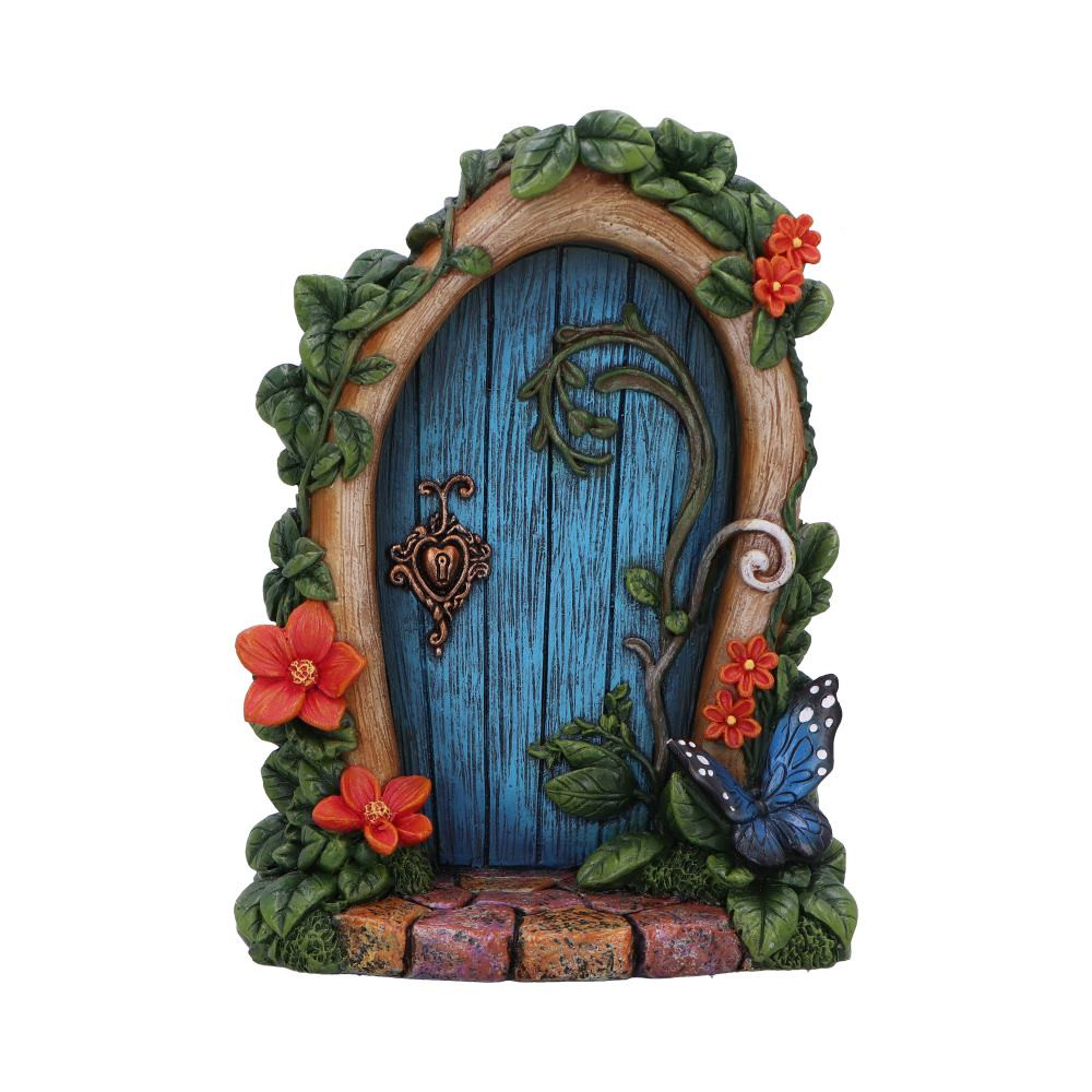 Fae's Enchanted Welcome – Mystical Fairy Door Fae's Enchanted Welcome is a captivating fairy door that invites magic into any space. Crafted from finely detailed resin, the door is adorned with intricate vines, orange flowers, and a butterfly perched on greenery. The charming blue door is framed by a wooden arch, with a detailed lock adding to its whimsical charm. The cobblestone base adds realism, while the high-quality craftsmanship makes this piece perfect for any fantasy, fairy, or mystical collection. Securely packaged, it arrives ready to enhance your shelves. Ideal for retailers specializing in fantasy, fairy, or mystical décor, Fae's Enchanted Welcome appeals to customers seeking unique and magical items. Its enchanting design is sure to be a customer favorite, adding a touch of whimsy to any collection.