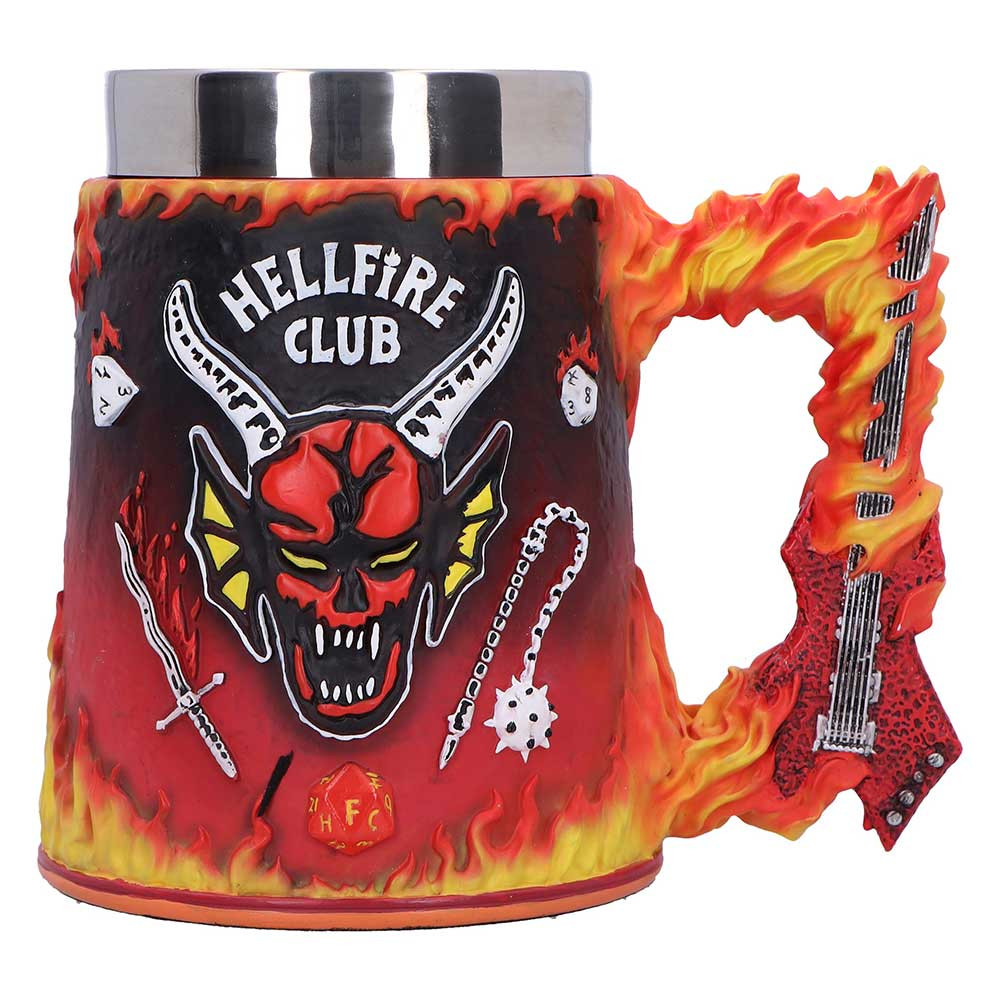 This officially licensed Stranger Things Hellfire Club Tankard is a must-have for fans of Eddie Munson and Hawkins' most metal D&D crew. Featuring a fiery red design with the Hellfire Club logo on the front, Eddie’s silhouette on the back, and his flaming guitar as the handle, this tankard brings bold, dramatic detail to any collection. Packaged in a full colour gift box, it’s perfect for gifting or display. Ideal for collectors, fans of the show, and lovers of all things supernatural and nostalgic. Bring home a piece of the Upside Down today.