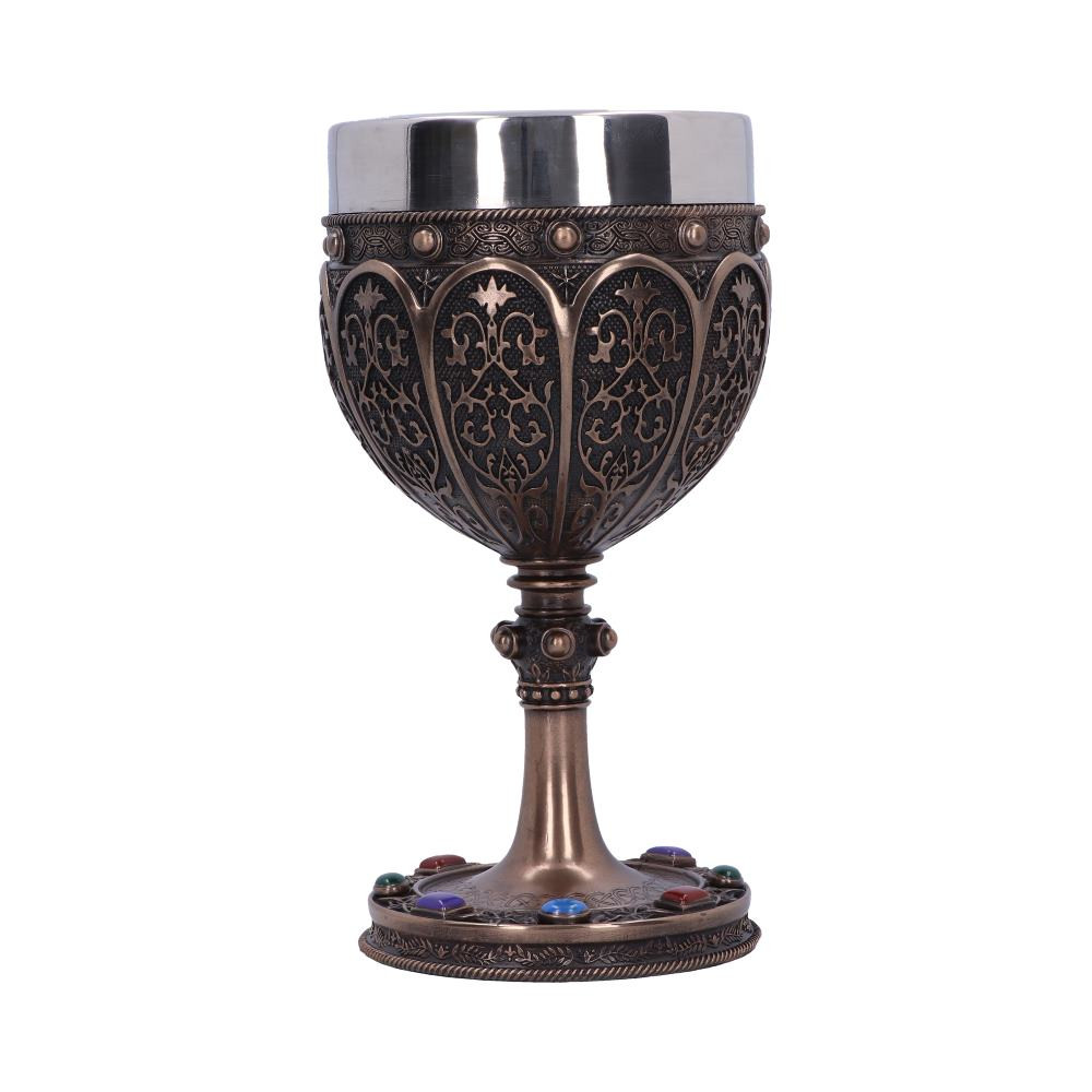 Yes, it is true! You have found the one and only Grail! Designed by Nemesis Now's inspired in-house team, this chalice is based on the Holy Grail. It features a wider, more rounded cup, decorated in extravagant arches filled with elaborate patterns. As you move down to the stem, its simple texture is broken up by a decorative orb. The base replicates the patterns on the cup and is filled with raised jewels. Cast in the finest resin before being expertly hand-painted and finished in Bronze, this mythical goblet will have anyone in awe and wonder!
