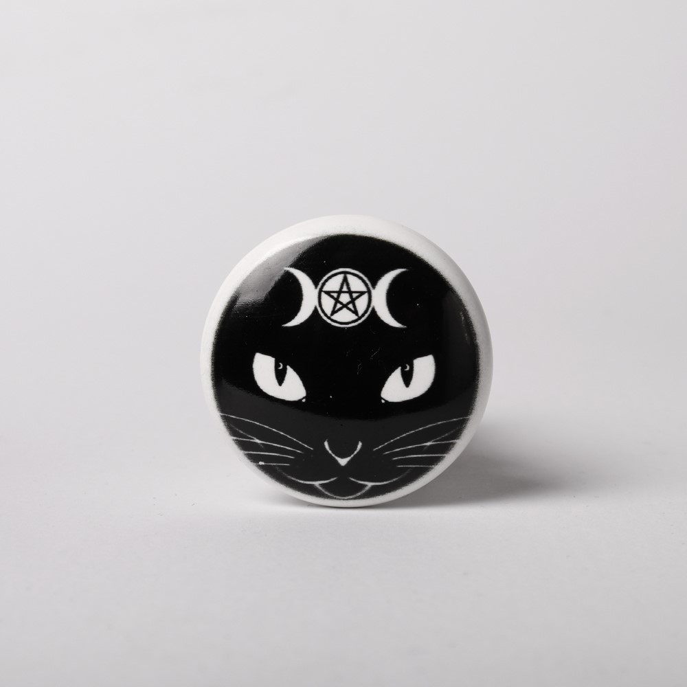 A magic black cat guards your sacred drink!