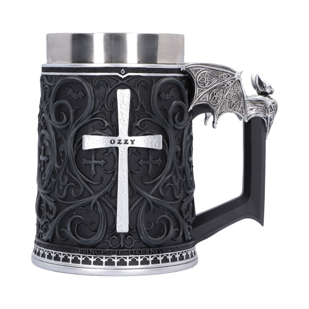 The officially licensed Ozzy Osbourne Prince of Darkness Tankard from Nemesis Now is a striking tribute to one of rock and metal’s most iconic legends. Featuring an intricate gothic pattern, a silver cross engraved with Ozzy’s name, logo displayed on the back and a detailed silver bat adorning the top of the handle. This expertly hand-painted tankard is cast in the finest resin and includes a removable stainless steel insert. Packaged in an officially licensed Ozzy Osbourne display box, it is perfect for fans of Ozzy, heavy metal enthusiasts, collectors, and lovers of gothic decor. Whether displayed proudly in your collection or used for your favourite beverage, this unique tankard lets you celebrate the enduring legacy of the Prince of Darkness in style.