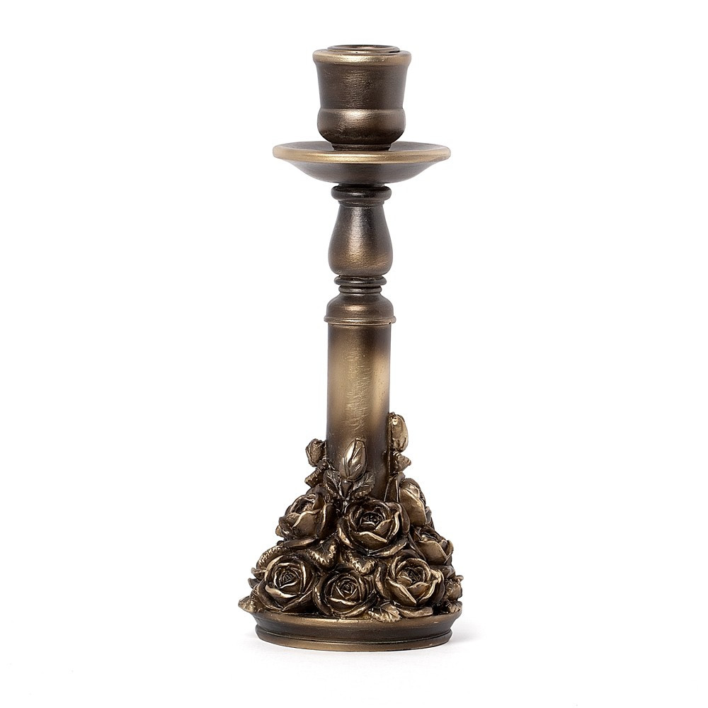 A gothic-inspired rose garden candlestick, richly detailed with entwined blooms and antique-style metalwork. This ornate candle holder evokes the beauty of a forgotten garden at dusk, where romance and decay intertwine. Crafted in resin with a burnished finish, it is designed to hold a single taper candle, making it perfect for atmospheric interiors, alt decor lovers, and those seeking dark elegance in their home styling. Specially selected and alchemised to complement our existing collections. • Ornate gothic rose candlestick with intricate floral detailing • Designed to hold a single taper candle • Antique-inspired finish for vintage and dark decor styles • Ideal for gothic interiors, romantic table settings, or alt home decor • Crafted in durable resin with a sculptural, decorative base • Specially selected to complement Alchemy's dark aesthetic collections Colour: Antique Gold