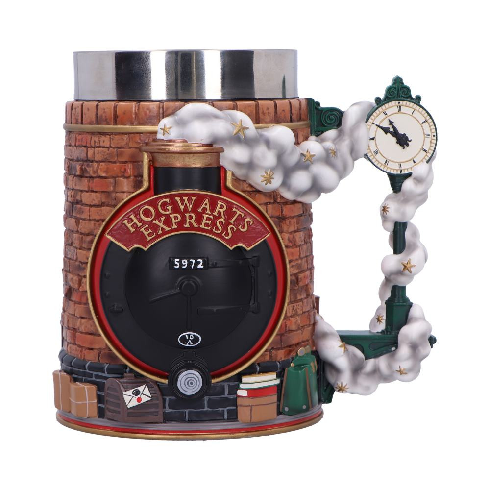 Step into the Wizarding World with the Harry Potter Platform 9 ¾ Collectible Tankard Immerse yourself in the magic of Harry Potter with the Harry Potter Platform 9 ¾ Collectible Tankard. This officially licensed, intricately designed tankard lets you relive the iconic Platform 9 ¾ scenes from the beloved series, making it a must-have for any fan. The front of the tankard features the Hogwarts Express in exquisite detail, with steam rising and wrapping around the station clock, which forms the handle. On the back, the iconic Platform 9 ¾ sign is set between platforms 9 and 10, framed by a beautifully sculpted brickwork background. The base features delightful touches, including stacked suitcases, a Gryffindor scarf, an acceptance letter, and Hedwig’s cage—capturing the essence of the wizarding world. More than just a decorative piece, this tankard is practical too. It includes a removable stainless steel insert for easy cleaning, while the stunning resin design remains a visual highlight. Whether you're sipping your favorite beverage while watching the films or showcasing it as a centerpiece in your collection, this collectible tankard perfectly combines form and function. The hand-painted resin material and meticulous attention to detail make it a true collector’s item, bringing the magic of Hogwarts into your home in a way no ordinary mug can. Packaged in a premium, official Harry Potter-branded plastic-free window box, this collectible tankard is ready to shine in your home or store. The open-front design ensures it’s perfect for display, while the protective cover keeps it safe and dust-free. Ideal for Harry Potter fans of all ages, collectors, or anyone looking to add a touch of magic to their daily routine, this tankard is a magical addition to any collection. Bring the magic of Hogwarts to your home today with this beautifully crafted Harry Potter collectible tankard. Perfect for any fan or collector.
